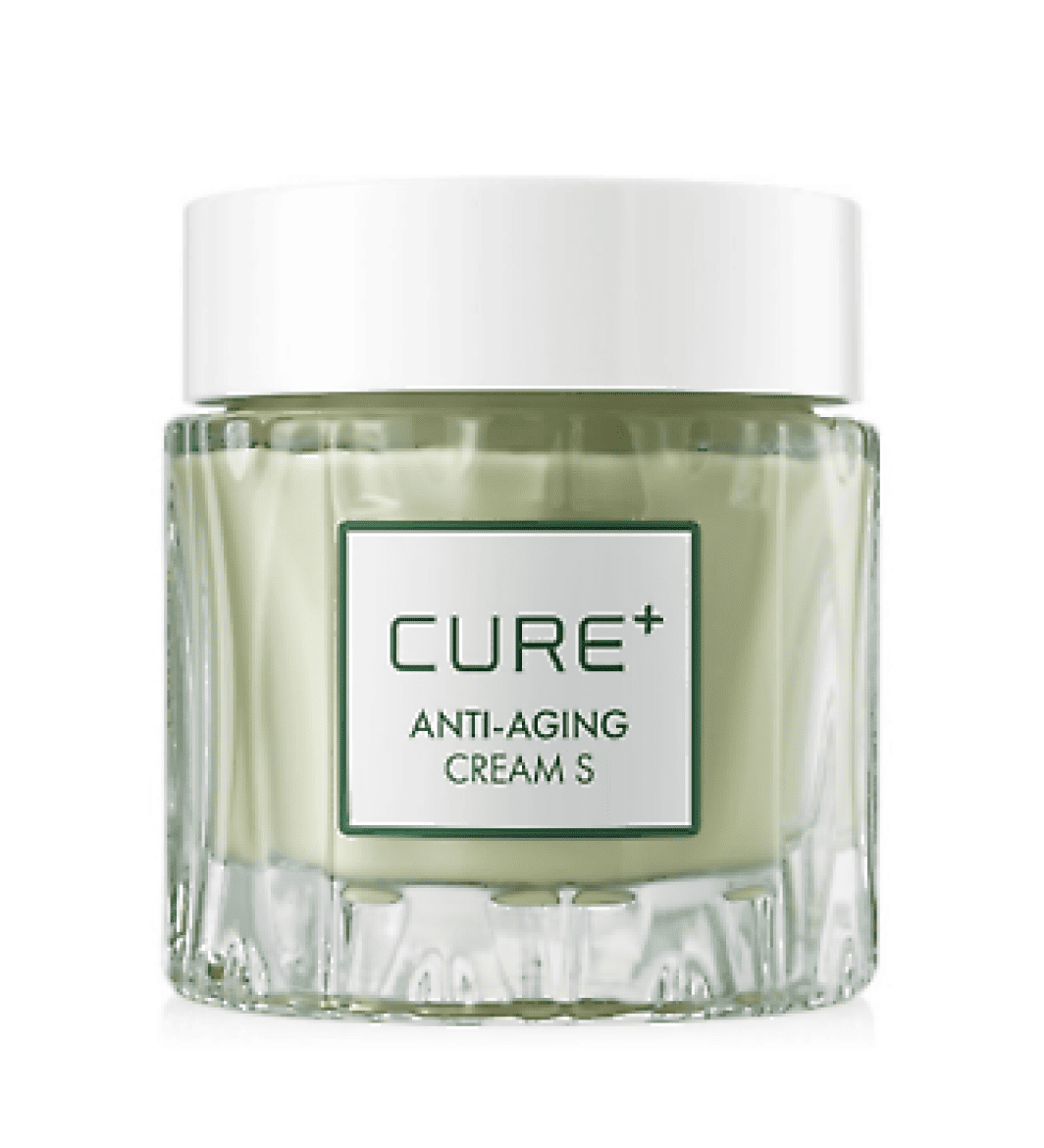 Прозора скляна баночка Cure Anti-Aging Cream з білою кришкою стоїть на білому фоні.