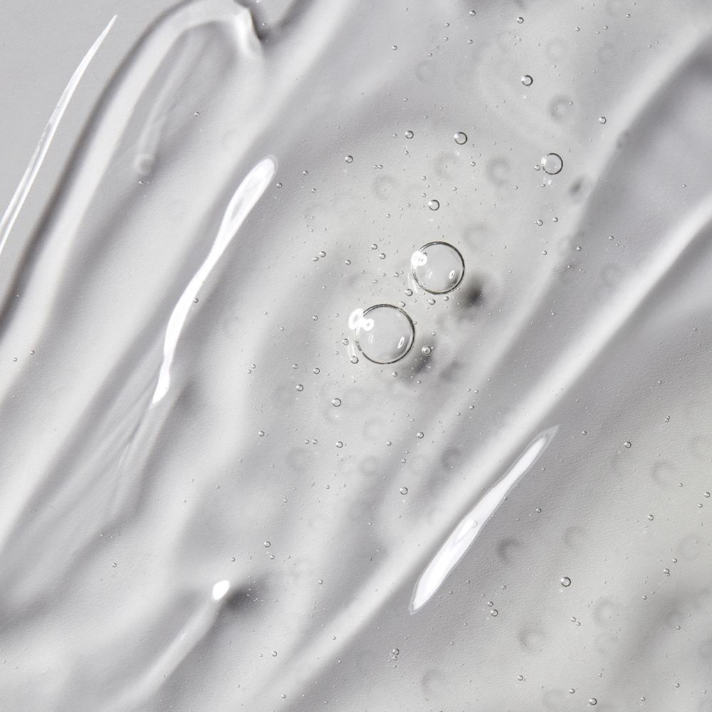 Картинка показує текстуру засобу Solep Premier Hi-gro Scalp Ampoule Pack — прозору гелеву текстуру