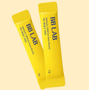 Два жовтих саше BB LAB Retinol C 1000 на жовтому фоні.