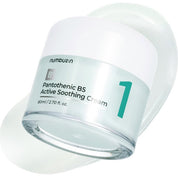 Баночка крему Numbuzin No.1 Pantothenic B5 Active Soothing Cream лежить на боці, на текстурі крему